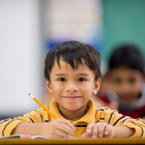 smiling kid with pencil