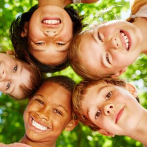 smiling kids looking down at camera