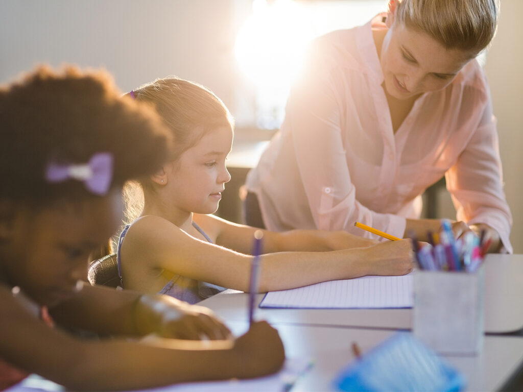 Teacher helping her student understand a new concept